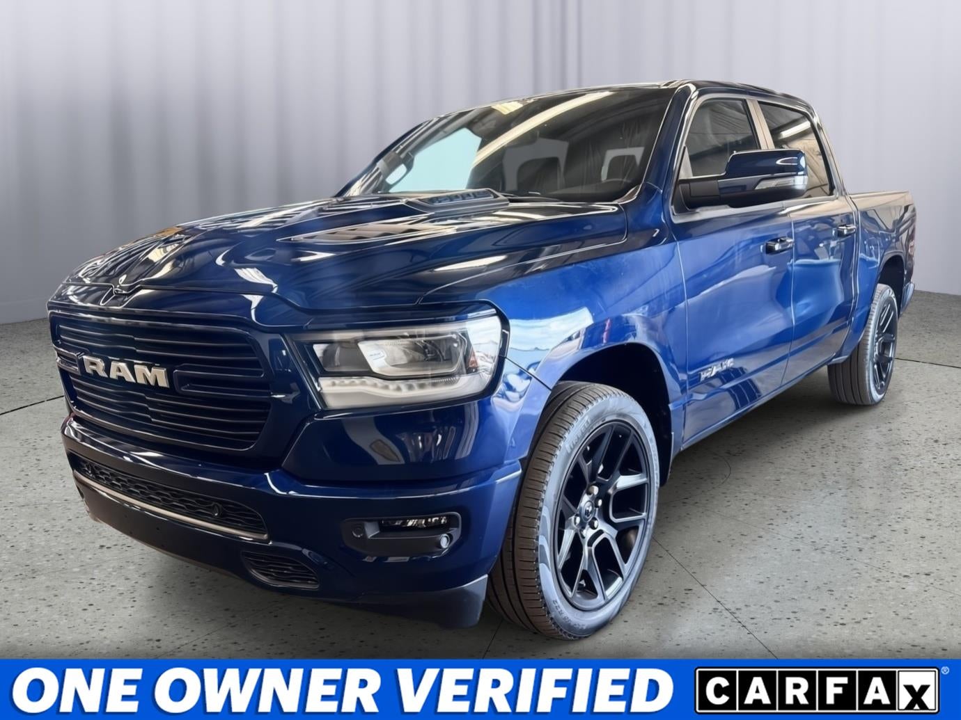 2023 RAM 1500 Laramie Crew Cab 4x4 5'7' Box in Patriot Blue Pearlcoat — front three-quarter view