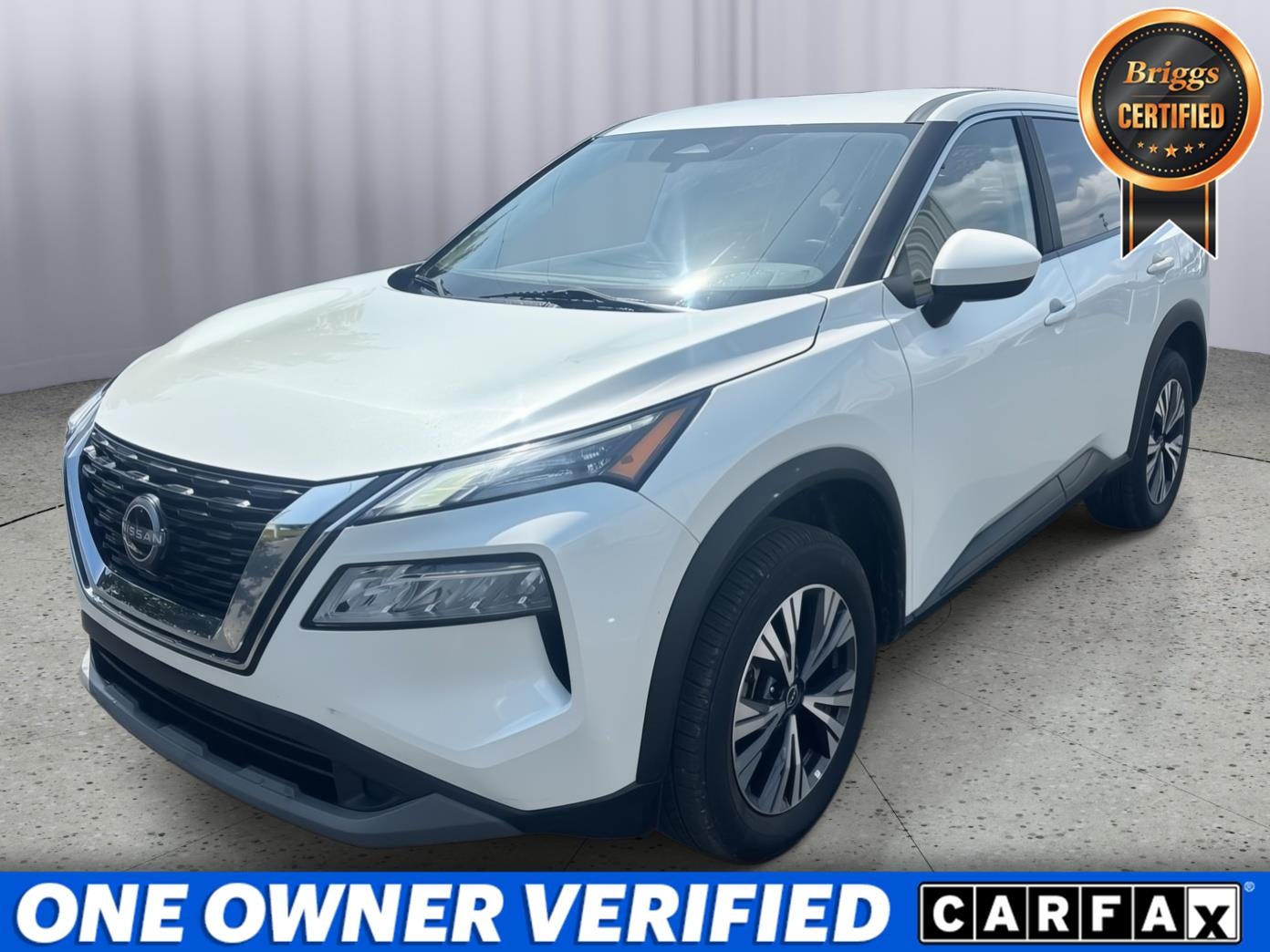 2023 Nissan Rogue SV Intelligent AWD in Pearl White Tricoat — front three-quarter view