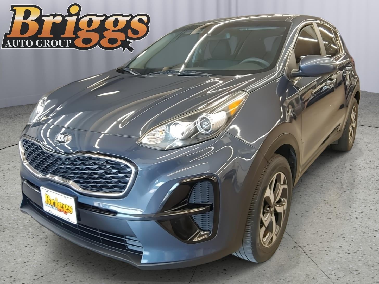 2021 Kia Sportage LX in Pacific Blue — front three-quarter view